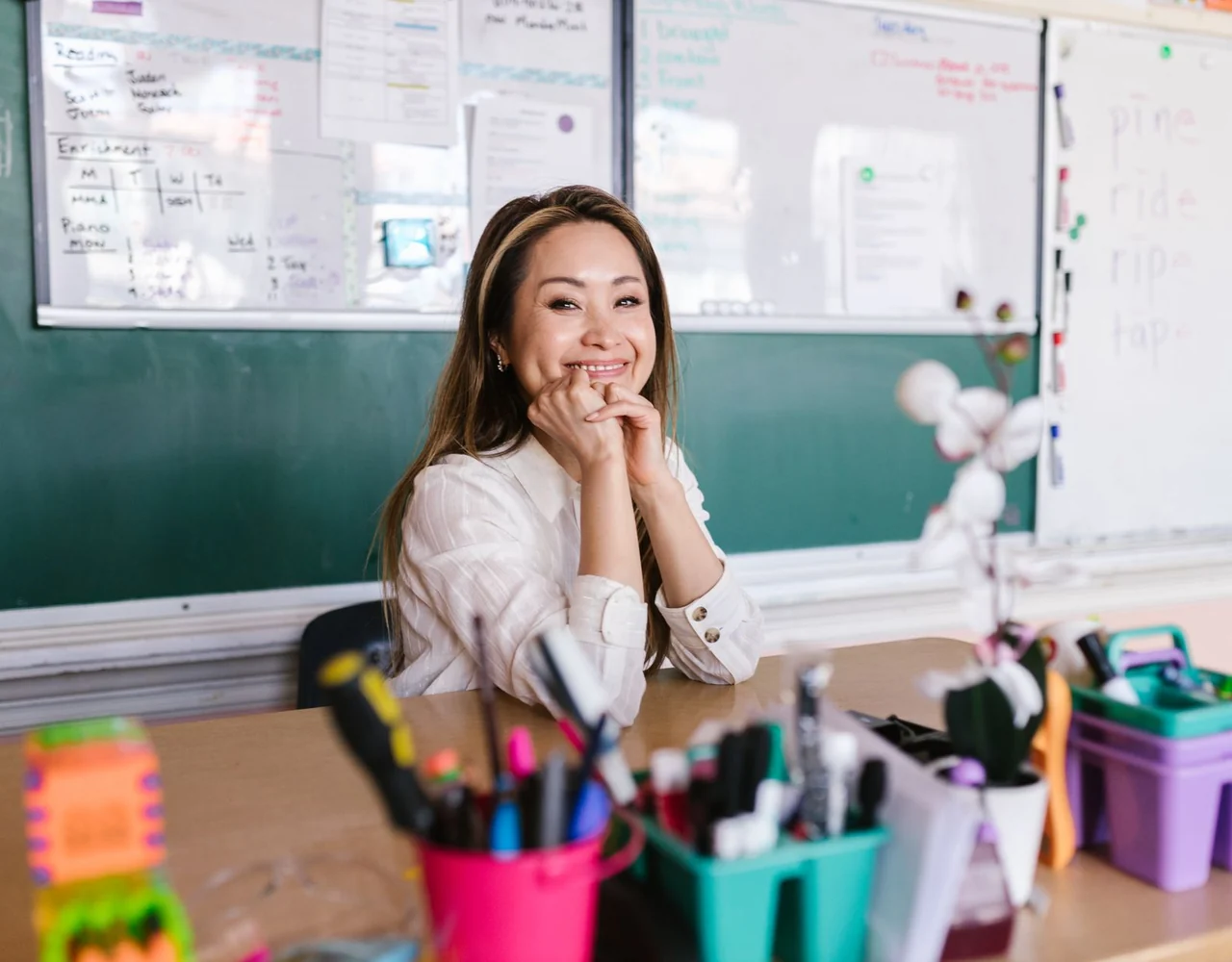 A teacher meeting with a pupil and parent